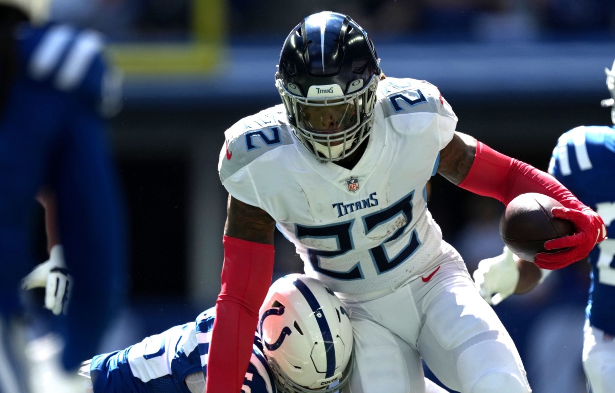 Indianapolis Colts safety Rodney Thomas II (25) works to bring down Tennessee Titans running back Derrick Henry (22) on Sunday, Oct. 2, 2022, during a game against the Tennessee Titans at Lucas Oil Stadium in Indianapolis.